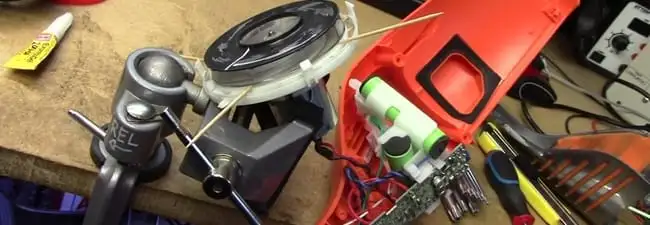 Vacuum cleaner repair parts and tools on a workbench in Bakersfield, CA